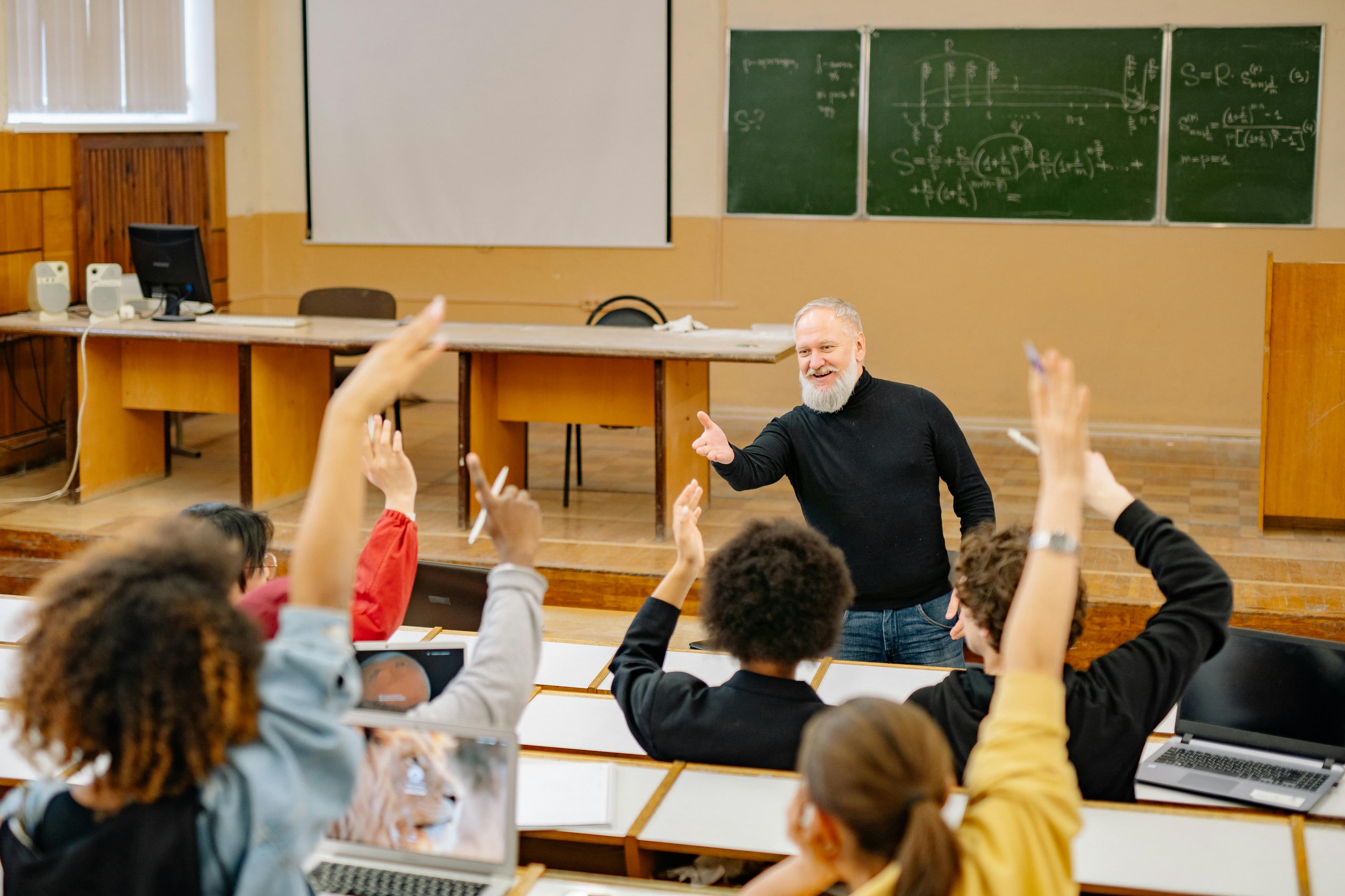 Professor engaging with students in an interactive classroom setting